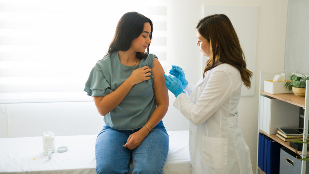 woman getting an injection of Depo-Provera, which has been linked to brain tumors - LLN