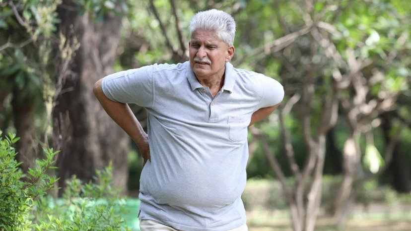 man in park with severe back pain - Lawsuit Legal News